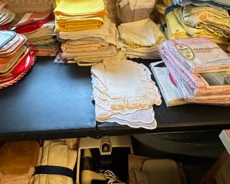 Here are a few tablecloths, some more set sheets, mint in the original package and other linens