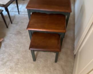This is a an adorable three-piece set stacking tables
