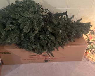 One of two full-size artificial Christmas trees