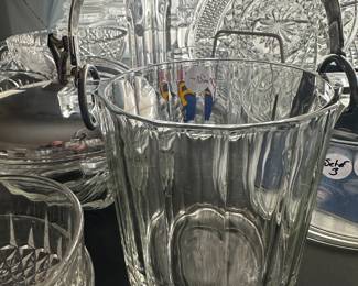 This is also a late find it is a mid-century, modern clear glass ice bucket with a silver plated handle. It’s really heavy and really lovely.!