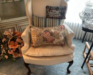 This is one of a pair of lovely ivory colored wingback chairs in excellent condition!