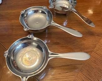This is the set of three very cool mid-century modern metal ashtrays!