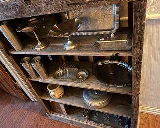 Hammered aluminum on a barnwood shelf