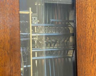 Inside view of grandfather clock.