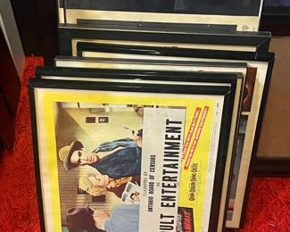 Framed movie theater lobby advertisements 