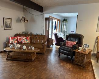 Leather sofa and claw-footed recliner