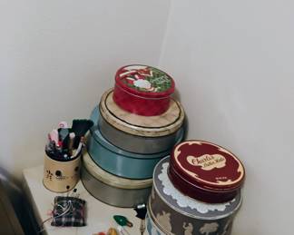 Vintage tins filled with buttons and sewing supplies