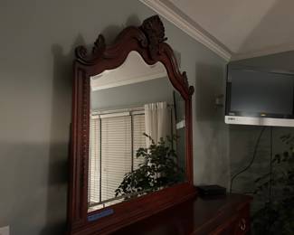 Beautiful, ornate, wooden mirror. Matches to the dresser set pictured before. 