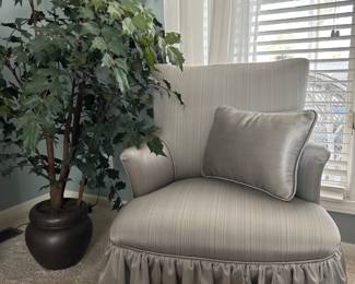 Beautiful blue chair and faux plant. Many more faux plants and trees throughout the house! 