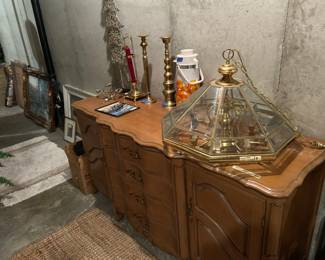 Beautifully crafted buffet table, many small area rugs, gorgeous chandelier, and candlesticks for sale! 