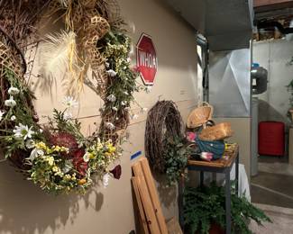 More spring wreaths, faux plants, wicker baskets, LARGE checked suitcase, and filing cabinet. Two filing cabinets available throughout the home. 