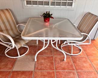 Frosted glass patio table with swivel chairs 