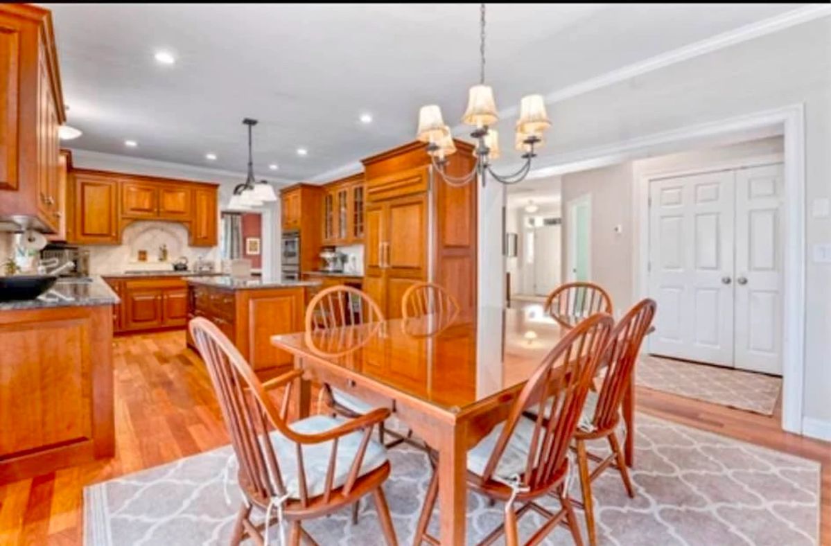 custom made cherry dining set made in Gardner, MA shaker style with glass top. Pottery barn cushions included with chairs.