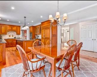 custom made cherry dining set made in Gardner, MA shaker style with glass top. Pottery barn cushions included with chairs.