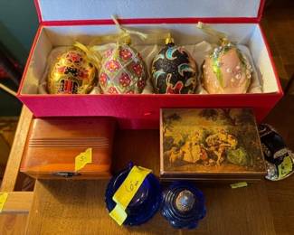 Set of four glass Christmas ornaments.