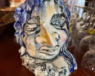 Local artist. C.S. Langille. Glaze. Pottery sculpture. Motion. Faces. Very cool!