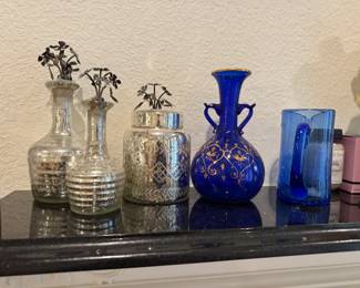 Matching set of Mercury glass bottles with decorative flower stoppers. Also, vintage cobalt vase. 