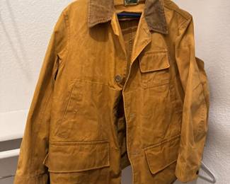 Vintage men's waterproof jacket with drop down hem.