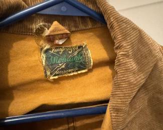 Vintage men's waterproof jacket with drop down hem.