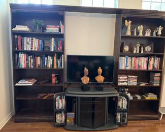 Books, CDs, DVDs, VHS, smart TV and DVD player