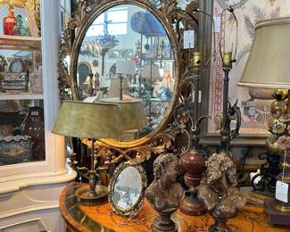Carved Giltwood Oval Mirror; 19th C. Brass Bouillotte Lamp; Pair of Majolica Busts; Hand Painted Demilune Console; and more