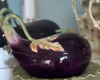 3-1/2 qt Fitz and Floyd Eggplant Tureen, part of the "Vegetable Garden" collection. It is a serving dish, typically used for soup or sauces, and often includes a lid and sometimes a ladle. Vintage and discontinued status contribute to its collectability.