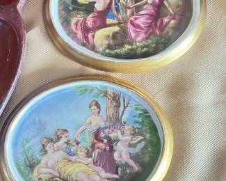 The images shows a porcelain wall plaque depicting an allegorical scene by D. Boucher, possibly titled "Allegorical Scene". Allegory in art uses subjects or elements to symbolize deeper meanings, often moral or spiritual, such as life, death, or love.
Key points:
Likely from the 18th or 19th century.
The scene is painted in a Rococo style, characterized by ornate detail and a focus on lighthearted themes.
The figures and composition suggest themes of mythology and classical art.
Similar pieces may be found in porcelain or Limoges enamel.