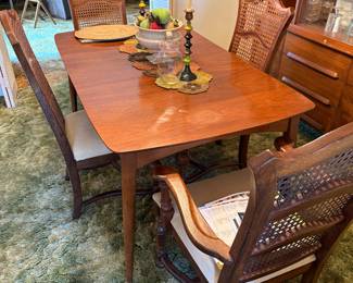 mid Century Modern dining room table with leaf and four chairs