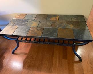 #31	metal and tile top coffee table 48x24x20, heavy - you move	 $175.00 
