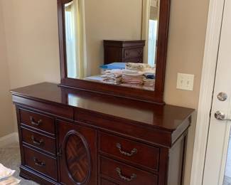 #40	dresser with 8 drawers, 1 door and mirror, Davis Int'l, 64x18x36, mirror is 46x43	 $175.00 
