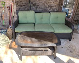#101	wicker sofa with cushions and with wicker and glass coffee table, couch is 77" long, coffee tabe is 26x40x19	 $175.00 
