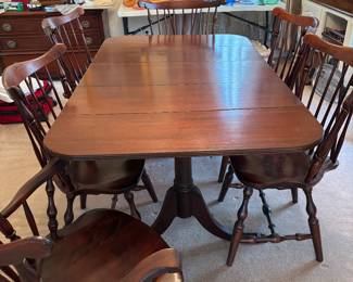 Dining table with 6 chairs and 2 leaves.  Folds into a drop leaf table 