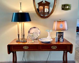 Baker Furniture drop leaf trestle base console table with lyre detailing on side legs.