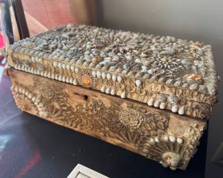 This is a late 1800s "sailor's valentine" shell encrusted wood box.