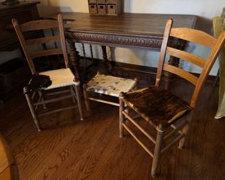 #4 - $120 - Set of 2 early American chairs with cow hide with ottoman.