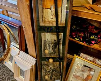 Golf art behind glass mancave