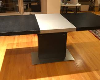 BoConcept dining table with leaf in place - built-in leaf folds in half & stores below tabletop (as shown here: 76”L, 35”D)