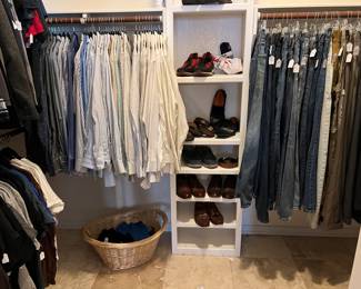 MEN'S WALK IN CLOSET.