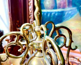 NOTICE THE DUCK MOTIF ON THE BRASS CANDELABRA.