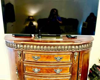 BOMBAY DEMILUNE CHEST WITH SMART FLAT SCREEN TV.
