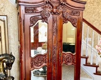 LARGE BEVELED MIRROR MAHOGANY ARMOIRE.