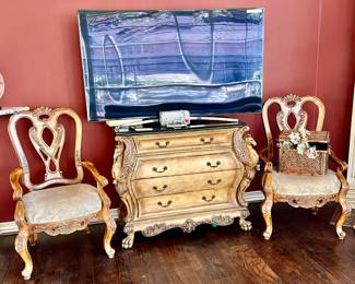 FLAT SCREEN CURVED SMART TV.  BOMBAY CHEST WITH HORSE CARVING.  THESE TWO CHAIRS GO WITH BREAKFAST TABLE.