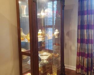 Tall cherry curio cabinet