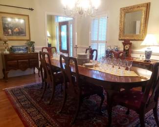 The table is 8.25 ft. long with its 2 leaves installed and 5.25 ft. without them.