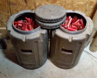 Two large canisters full of spent shotshells
