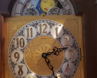 The grandfather clock shows moon phase.