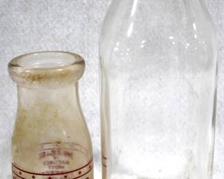 8673 - 2 Glass Milk Bottles - 5.5" & 9" Tall
