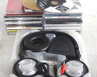 7752 - Lot of CDs & Wireless Headphones You are buying a used as-is electric/electronic item. We do not guarantee all components are present, and if it is not expressly stated, it is untested.

