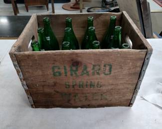 Vintage Girard Spring water bottles in wooden crate