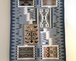 Navajo/Dine storm sampler rug with pictoral, traditional, tree of life and yei designs.